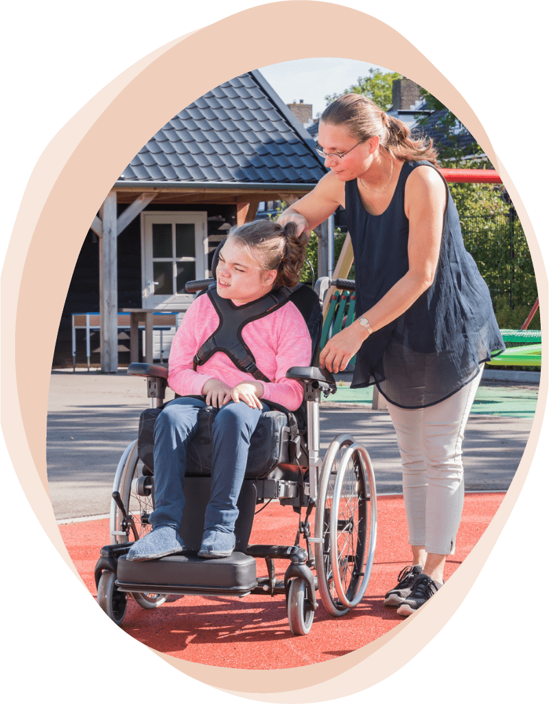support worker supporting young girl with a disability
